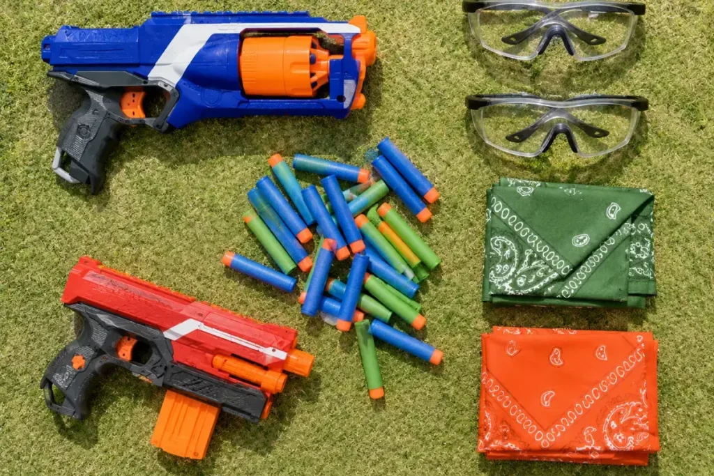 Nerf capture the flag gear: blasters, foam darts, safety goggles, and team bandanas